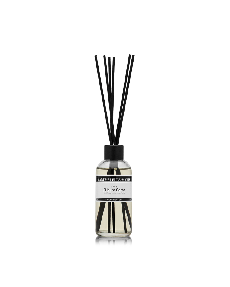 Marie-Stella-Maris Fragrance Sticks in No.13 L’Heure Santal, presented in a clear glass bottle with black fragrance reeds. The signature fragrance features notes of sandalwood, cardamom and tonka, photographed against a clean white background.