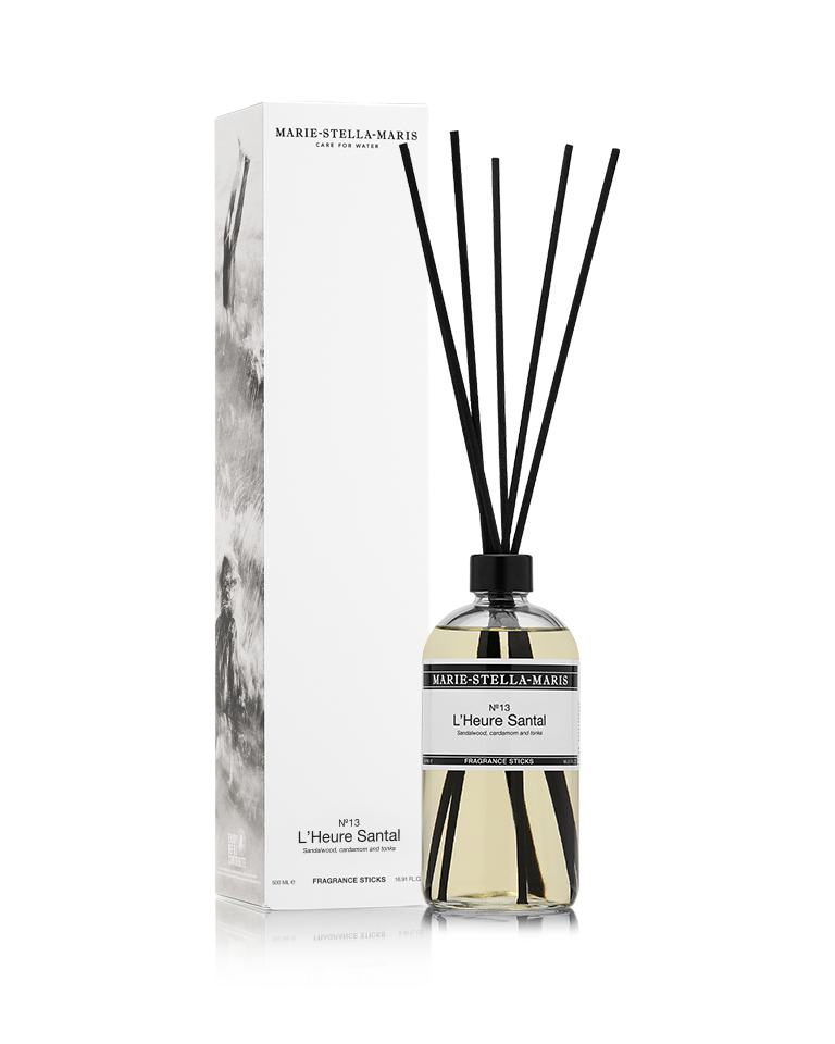 Marie-Stella-Maris No.13 L'Heure Santal Fragrance Sticks (500 ml) displayed alongside its white product box. The clear glass diffuser with black fragrance reeds features the No.13 L'Heure Santal fragrance with notes of sandalwood, cardamom and tonka in the brand's signature minimalist design.