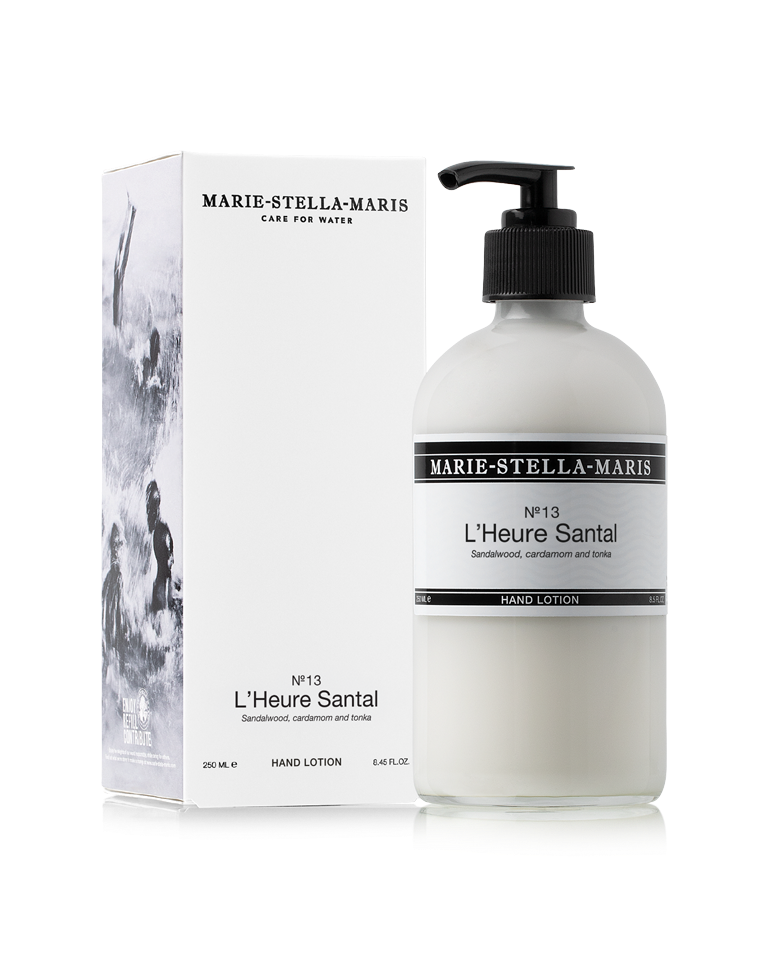 Marie-Stella-Maris No.13 L'Heure Santal Hand Lotion (250 ml) in a white pump bottle displayed alongside its white product box. The packaging features the No.13 L'Heure Santal fragrance with notes of sandalwood, cardamom and tonka in the brand's signature minimalist design.