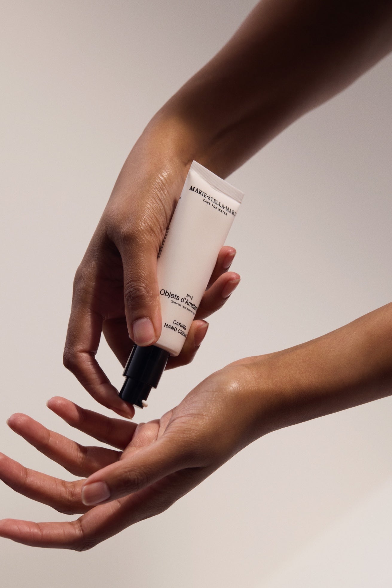 Marie-Stella-Maris Caring Hand Cream No.12 Objets d’Amsterdam 50 ml being applied to hands against a light background.
