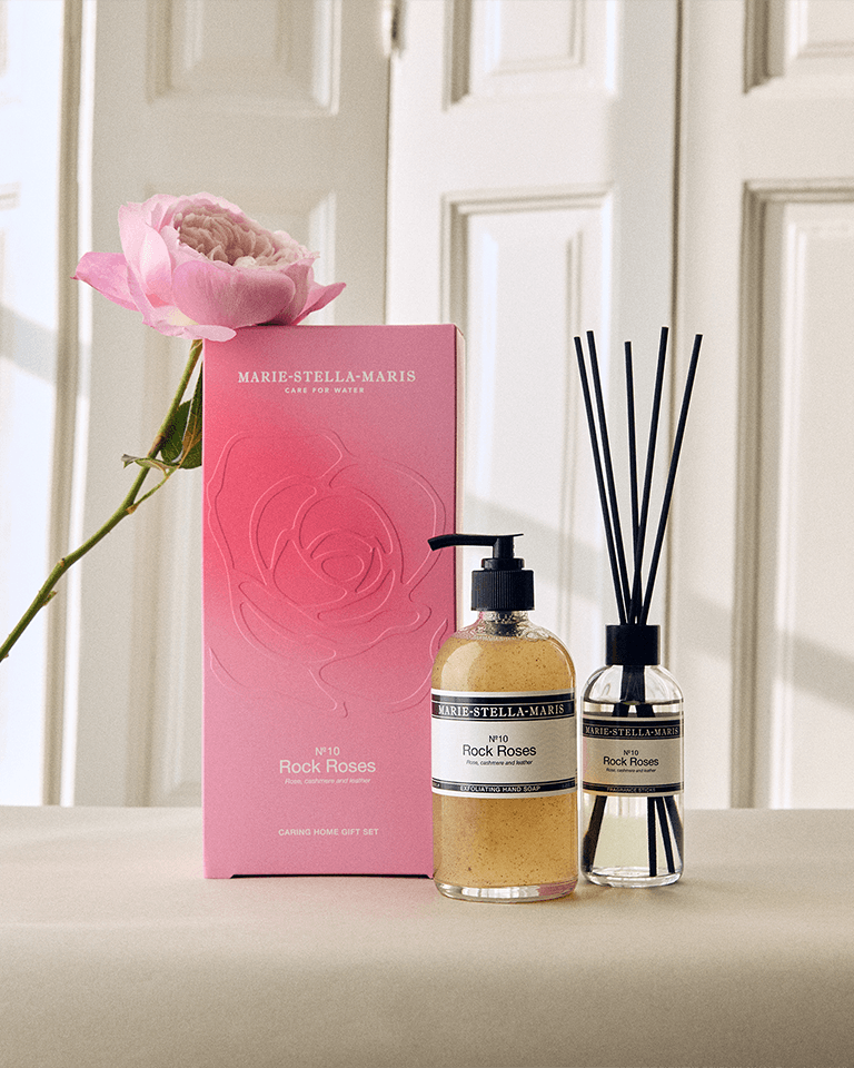 Marie-Stella-Maris No.10 Rock Roses limited edition Mother’s Day Caring Home gift set, featuring an exfoliating hand soap and fragrance sticks, styled with a pink rose in a soft, elegant interior setting.