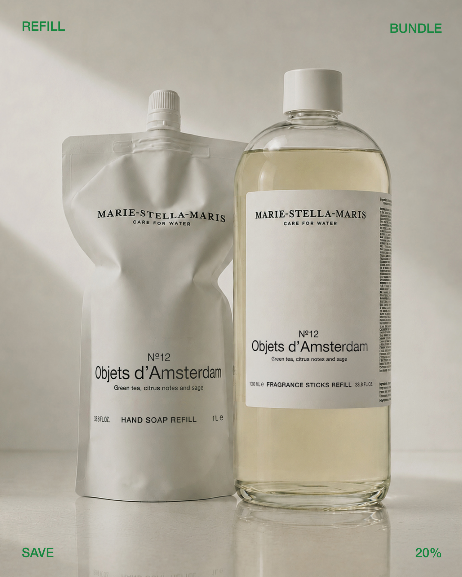 Marie-Stella-Maris refill and bundle products from the No.12 Objets d’Amsterdam collection displayed side by side on a neutral background. A white hand soap refill pouch stands next to a large refill bottle, highlighting a refill-and-save offer. Green text in the corners reads “REFILL,” “BUNDLE,” “AND,” and “SAVE.”