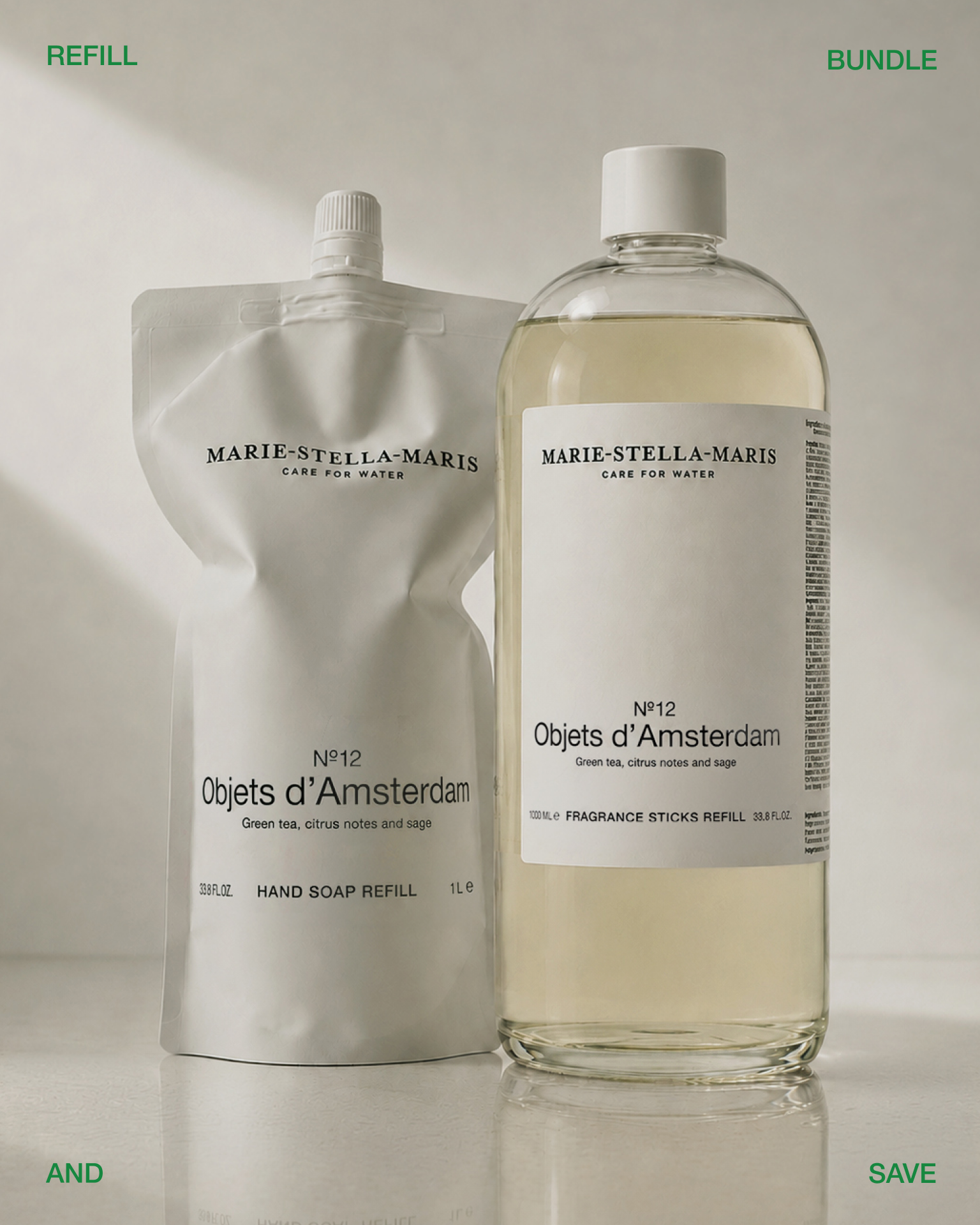 Marie-Stella-Maris refill and bundle products from the No.12 Objets d’Amsterdam collection displayed side by side on a neutral background. A white hand soap refill pouch stands next to a large refill bottle, highlighting a refill-and-save offer. Green text in the corners reads “REFILL,” “BUNDLE,” “AND,” and “SAVE.”