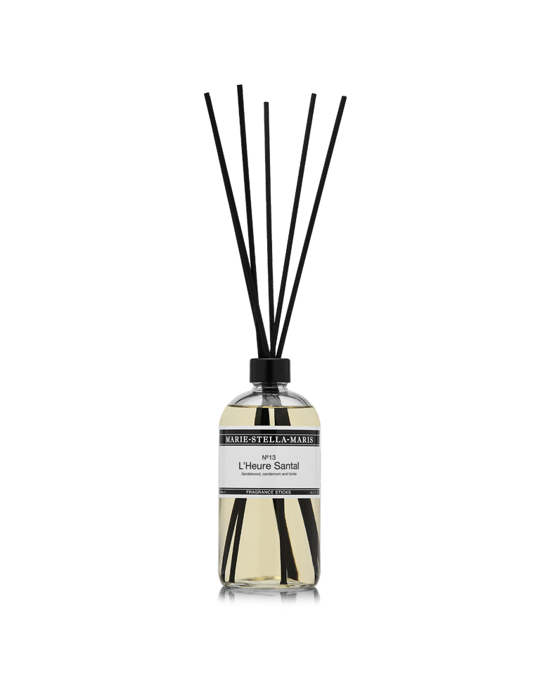 Marie-Stella-Maris No.13 L'Heure Santal Fragrance Sticks (500 ml) in a clear glass bottle with black fragrance reeds. The diffuser features the No.13 L'Heure Santal fragrance with notes of sandalwood, cardamom and tonka in the brand's signature minimalist design.