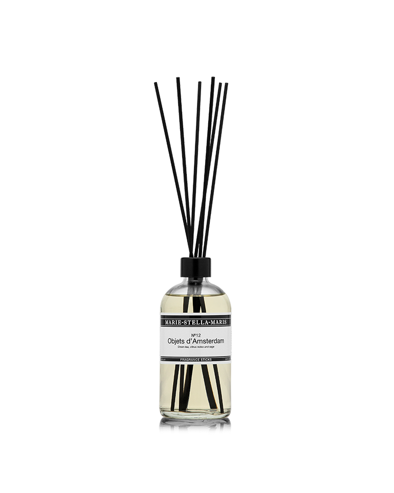 Luxury diffuser sticks in a clear glass bottle with black reeds, scent of green tea, citrus, and sage fragrance.