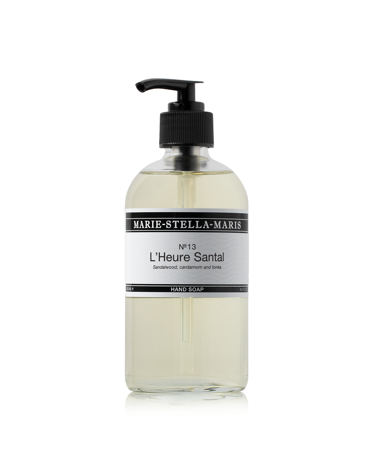 Marie-Stella-Maris Hand Soap in No.13 L’Heure Santal, presented in a clear glass bottle with a black pump. The signature fragrance features notes of sandalwood, cardamom and tonka, photographed against a clean white background.