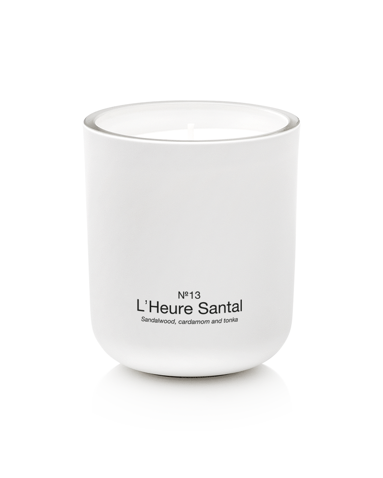 Marie-Stella-Maris Scented Candle in No.13 L’Heure Santal, presented in a matte white glass vessel. The signature fragrance features notes of sandalwood, cardamom and tonka, photographed against a clean white background.