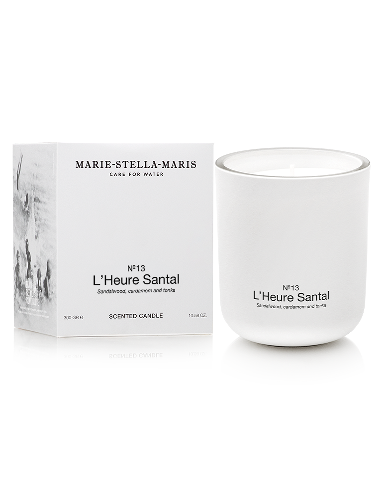 Marie-Stella-Maris Scented Candle in No.13 L’Heure Santal, presented in a matte white glass vessel alongside its white product box. The signature fragrance features notes of sandalwood, cardamom and tonka, photographed against a clean white background.