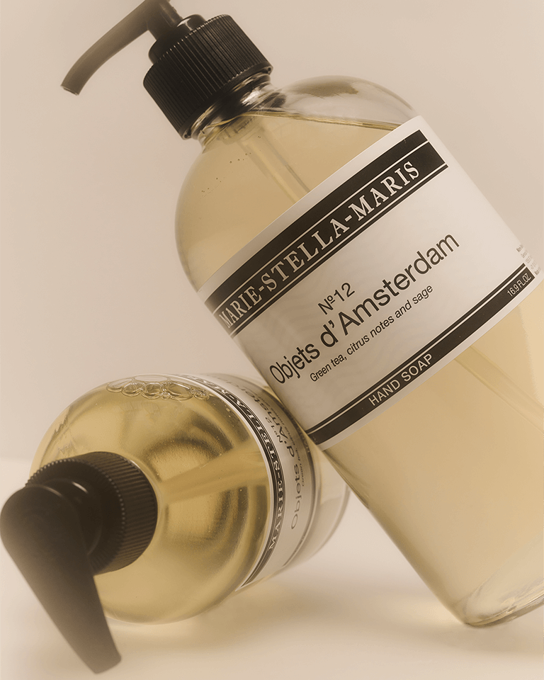 Marie-Stella-Maris No.12 Objets d'Amsterdam hand soap 500 ml in a clear bottle with black pump, lying on another No.12 Objets d'Amsterdam hand soap 500 ml