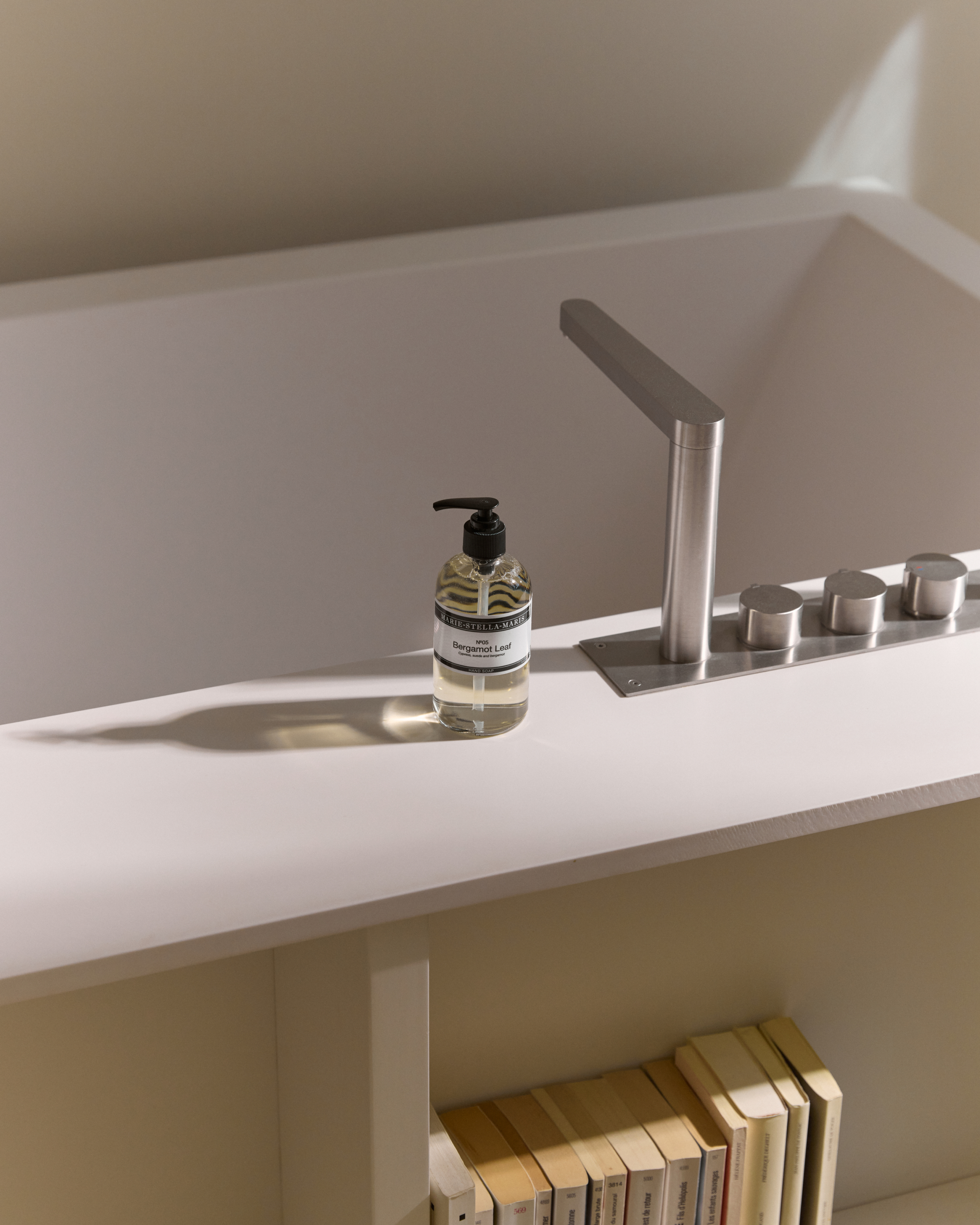 Marie-Stella-Maris No.05 Bergamot Leaf limited edition summer scent hand soap 250 ml, placed beside a modern sink in a minimal bathroom setting with warm light and clean, neutral tones.